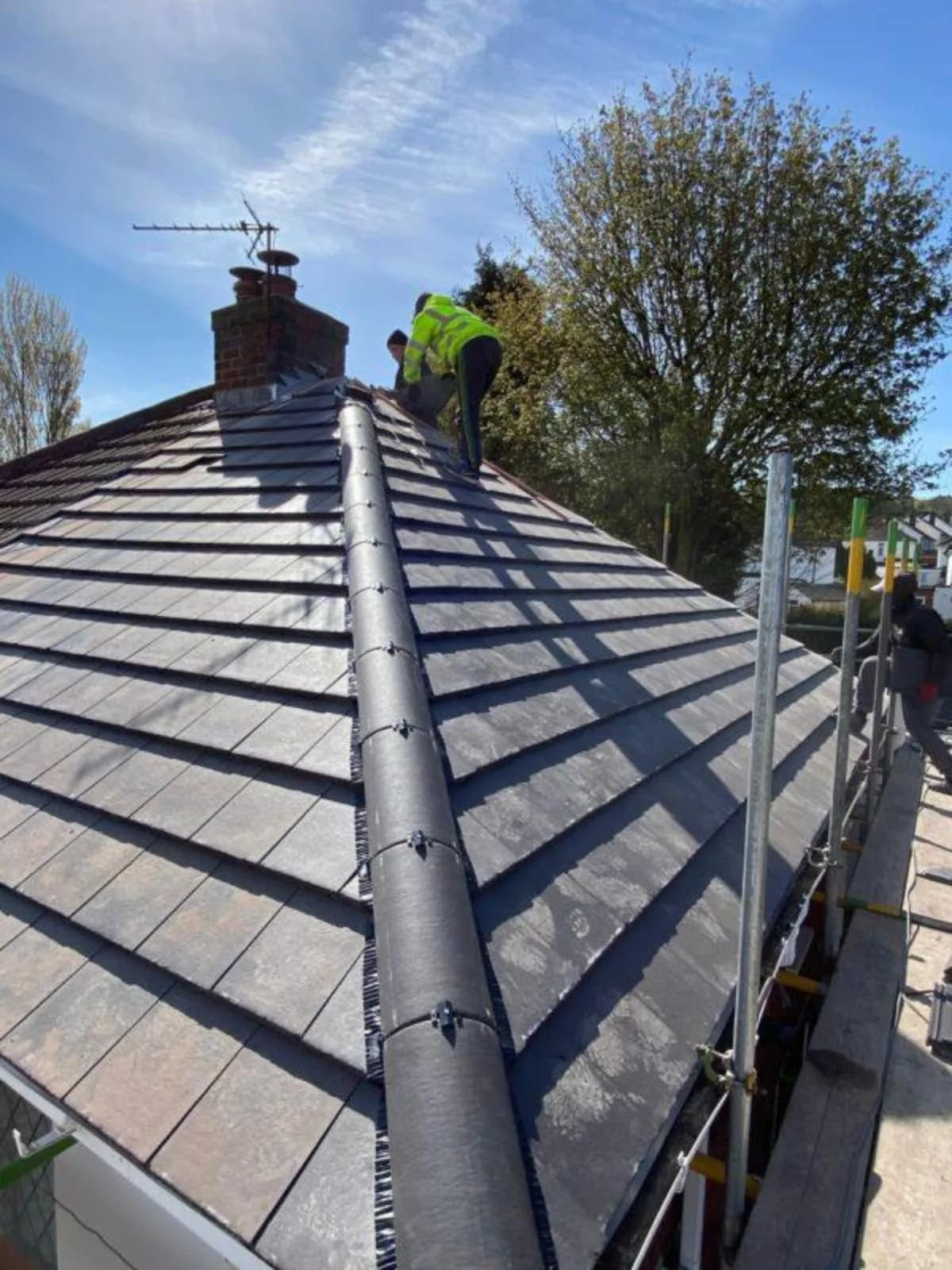 Liberty Contractors roofers installing a new roof